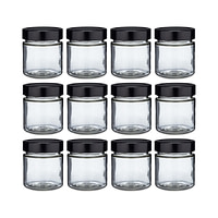 twelve glass jars with black lids on a white background