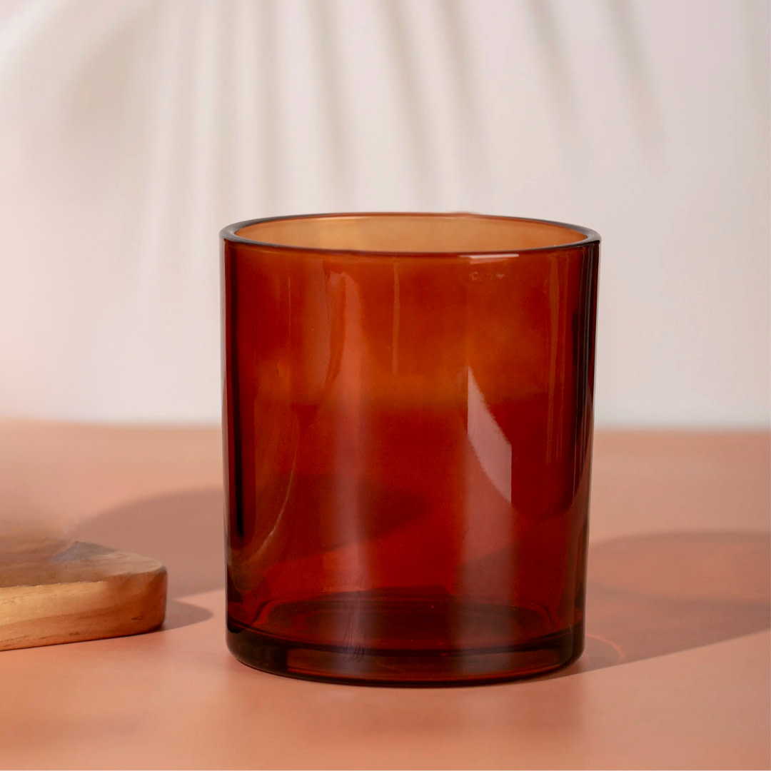 a glass sitting on top of a wooden cutting board