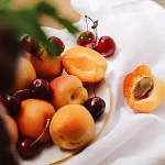 Representation of the fragrance oil includes apricots and cherries