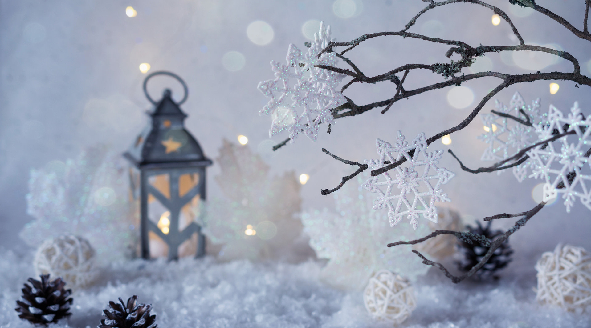 snowflakes, lanterns and pine cones on a white background