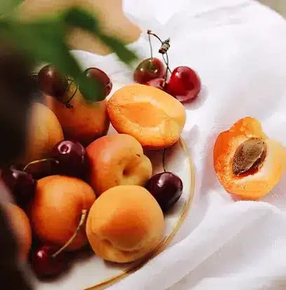 Representation of the fragrance oil includes apricots and cherries