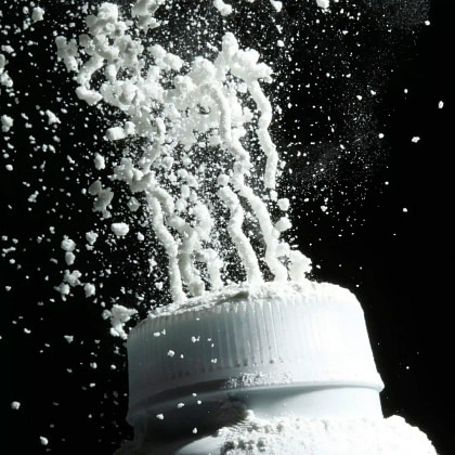 Captures white powder from bottle