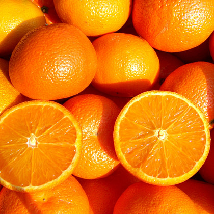 a close up of a bunch of oranges