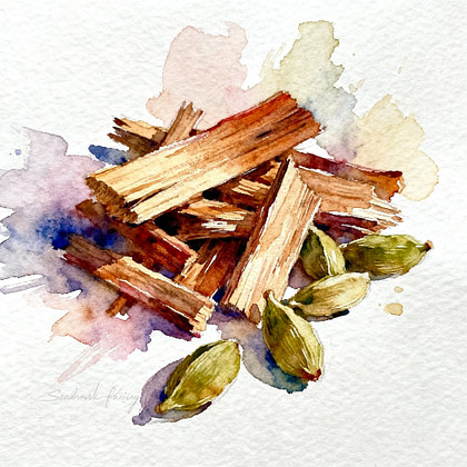 Chips of woods beside five green cardamom seed