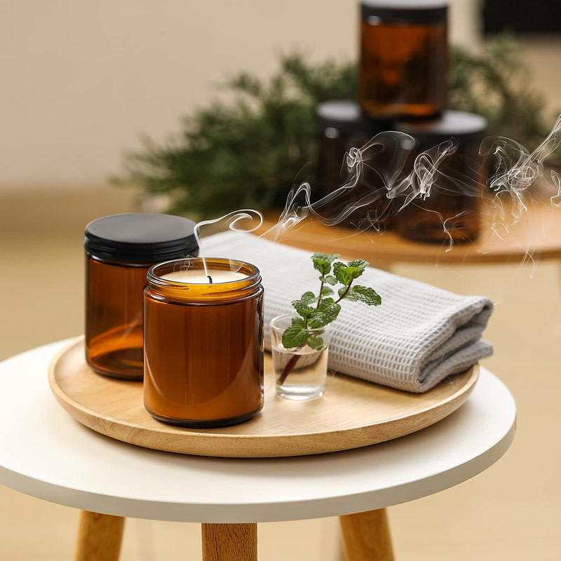 candles on a table with smoke coming out of them