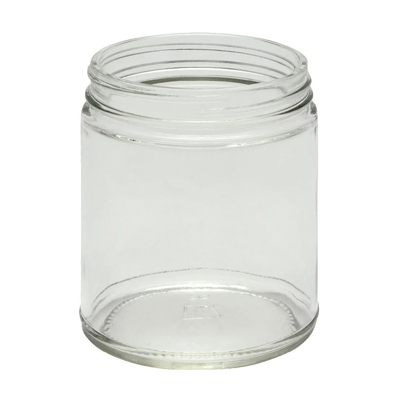a clear jar with a lid on a white background