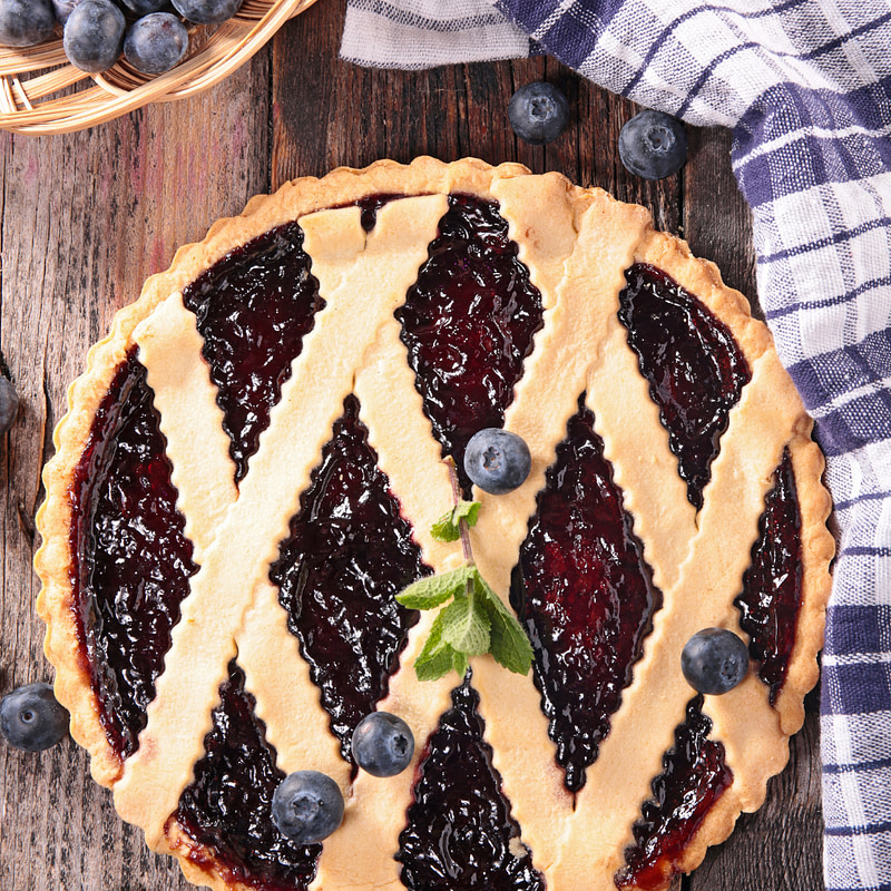 blueberry pie on a wooden table