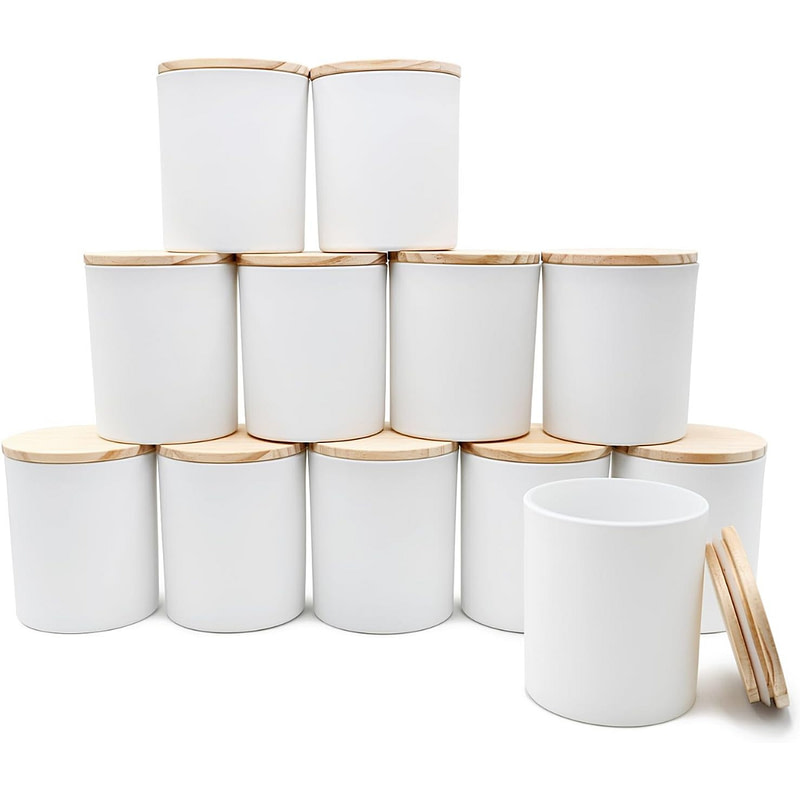 a stack of white jars with wooden lids