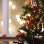 a close up of a christmas tree decorated with ornaments