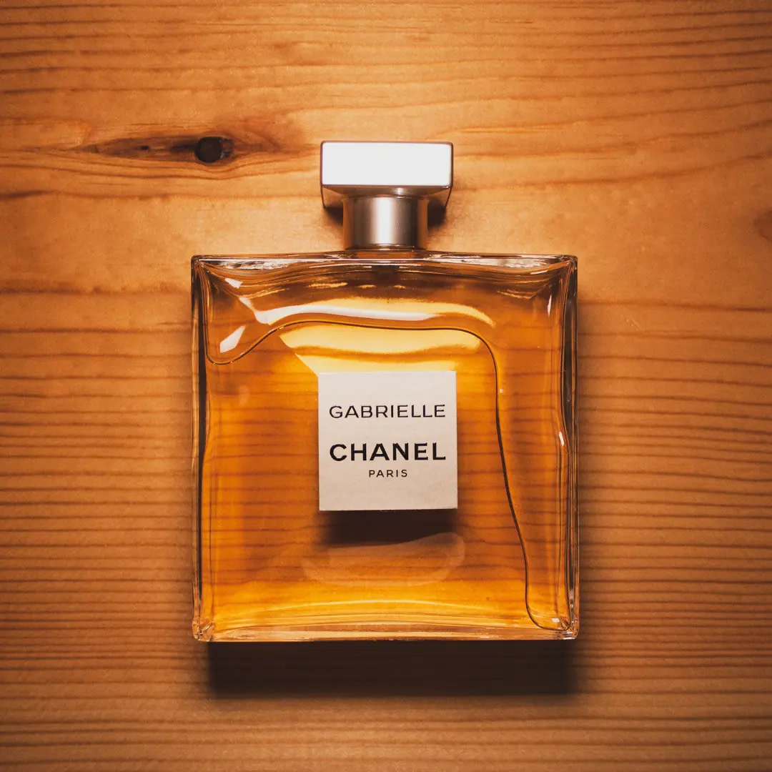 Chanel woman perfume on wood background